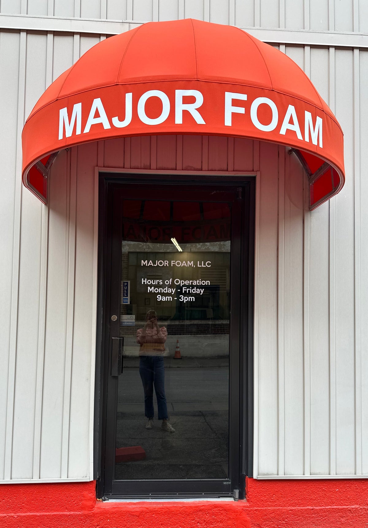 The orange Major Foam awning at the Cincinnati shop entrance